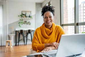Portrait of black woman working at home office